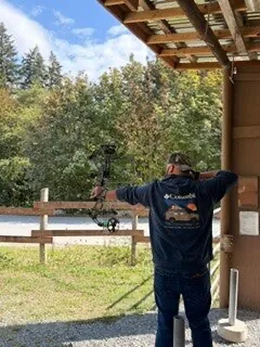 Archer at full draw at an outdoor range near Sultan, Washington